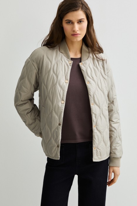 стеганая куртка от бренда снежная королева вид слева