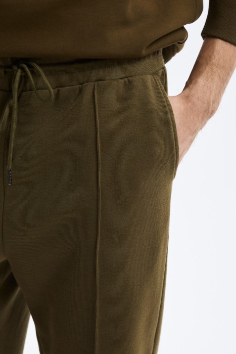 трикотажные брюки от бренда снежная королева вид слева