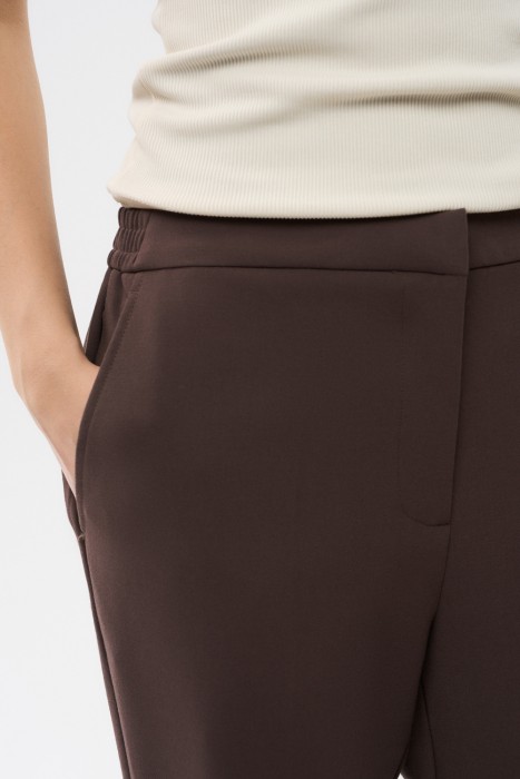 укороченные брюки из россии вид сбоку