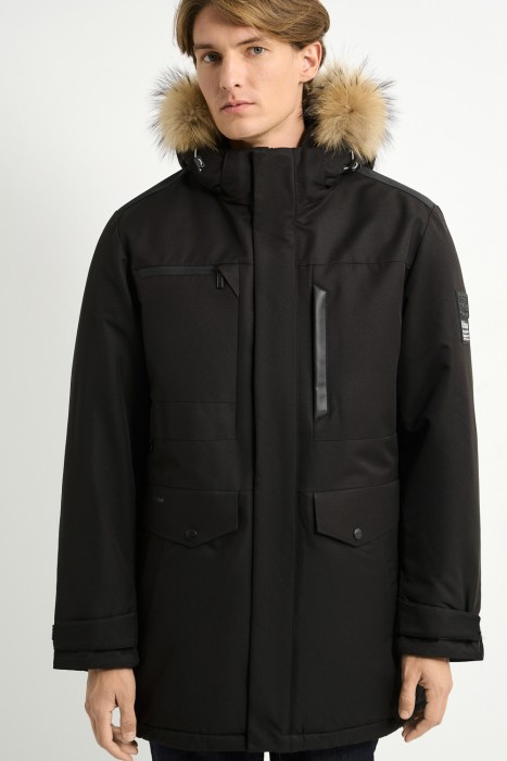 зимняя куртка с отделкой мехом енота от бренда снежная королева вид слева