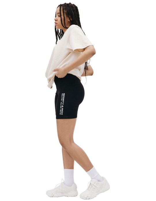 черные велосипедки с логотипом от бренда sporty & rich вид слева