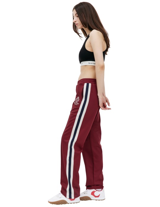 спортивные брюки crown с лампасами от бренда sporty & rich вид слева