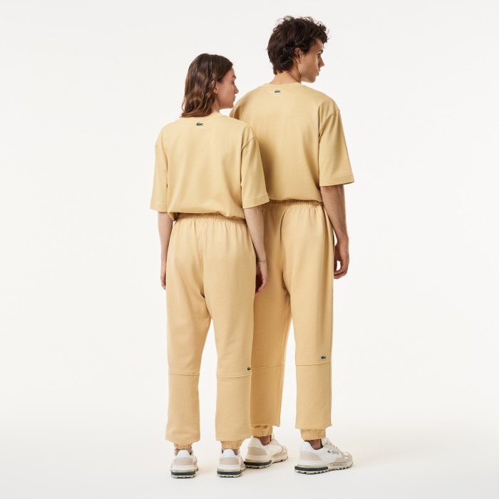 брюки  для спорта унисекс из органического хлопка от бренда lacoste вид слева