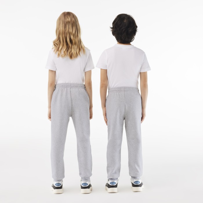 детские флисовые спортивные брюки  от бренда lacoste вид слева