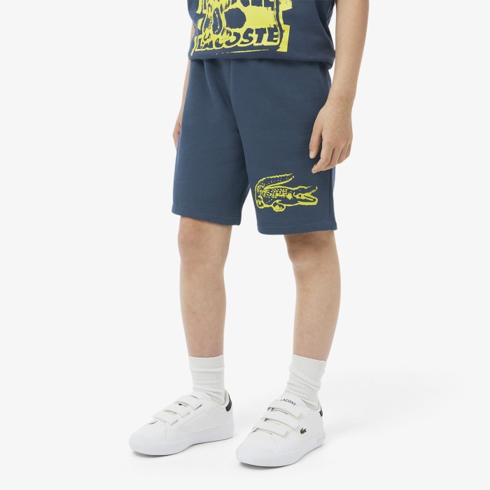 детские хлопковые шорты  от бренда lacoste вид слева