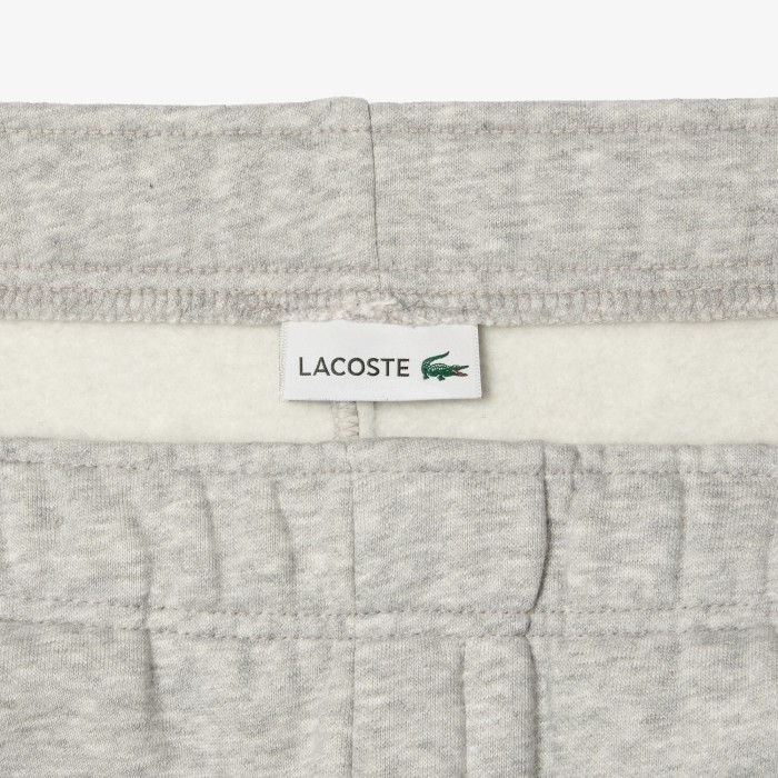 детские спортивные брюки  от бренда lacoste вид слева
