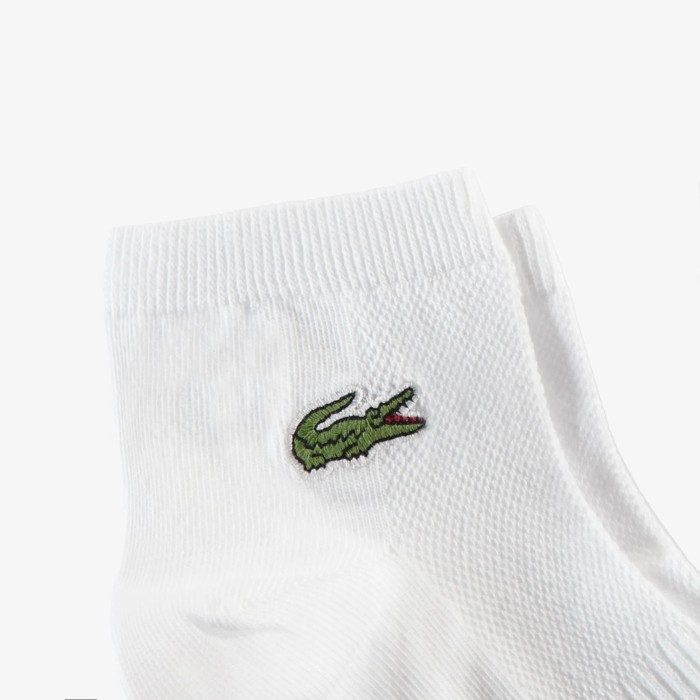 хлопковые носки  от бренда lacoste вид слева
