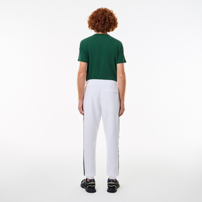 мужcкие спортивные брюки  стандартного кроя от бренда lacoste вид слева