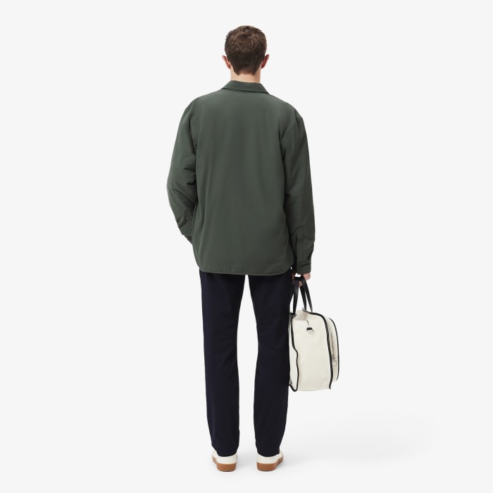 мужские брюки-чинос  из эластичного хлопка от бренда lacoste вид слева