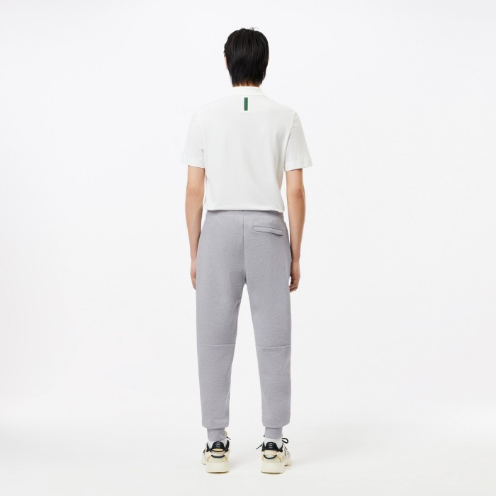 мужские брюки  для спорта из меланжевой смеси хлопка от бренда lacoste вид слева