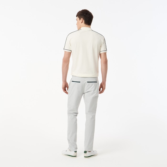 мужские брюки  из эластичного хлопка от бренда lacoste вид слева