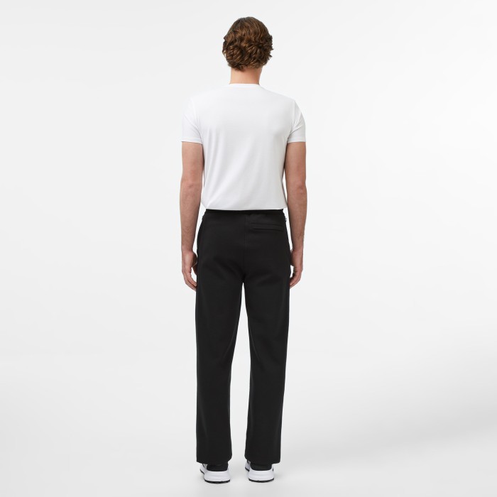 мужские хлопковые спортивные брюки  от бренда lacoste вид слева
