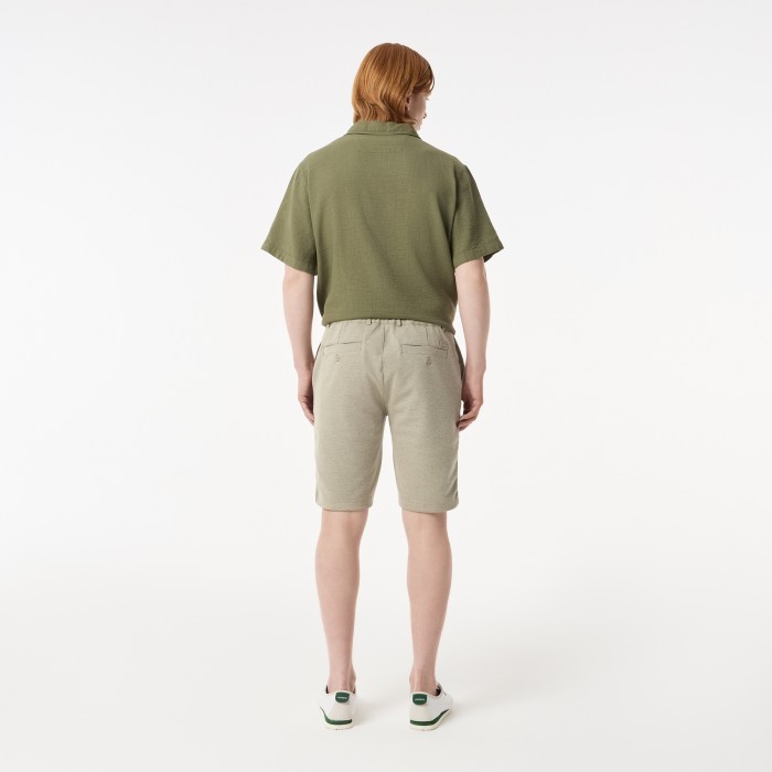 мужские легкие шорты  от бренда lacoste вид слева
