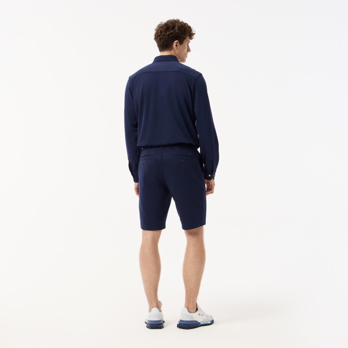 мужские легкие шорты  от бренда lacoste вид слева