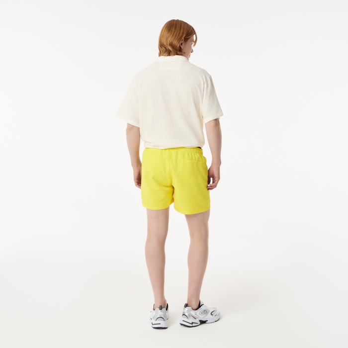 мужские плавательные шорты  от бренда lacoste вид слева