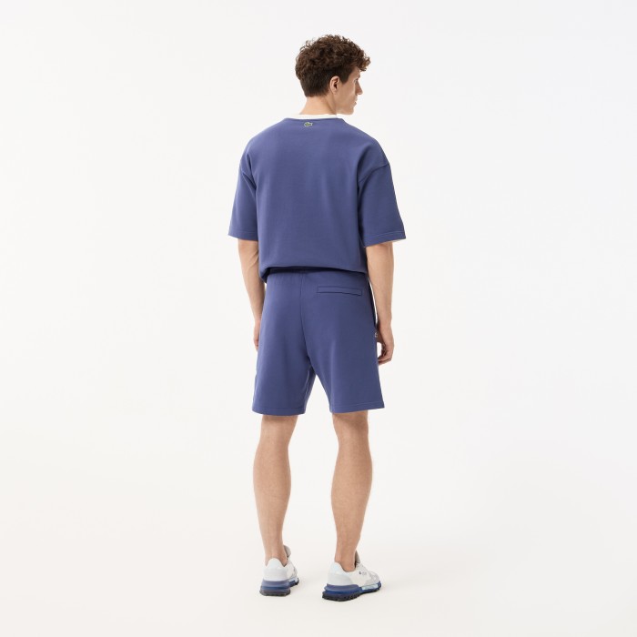 мужские шорты  из хлопка от бренда lacoste вид слева