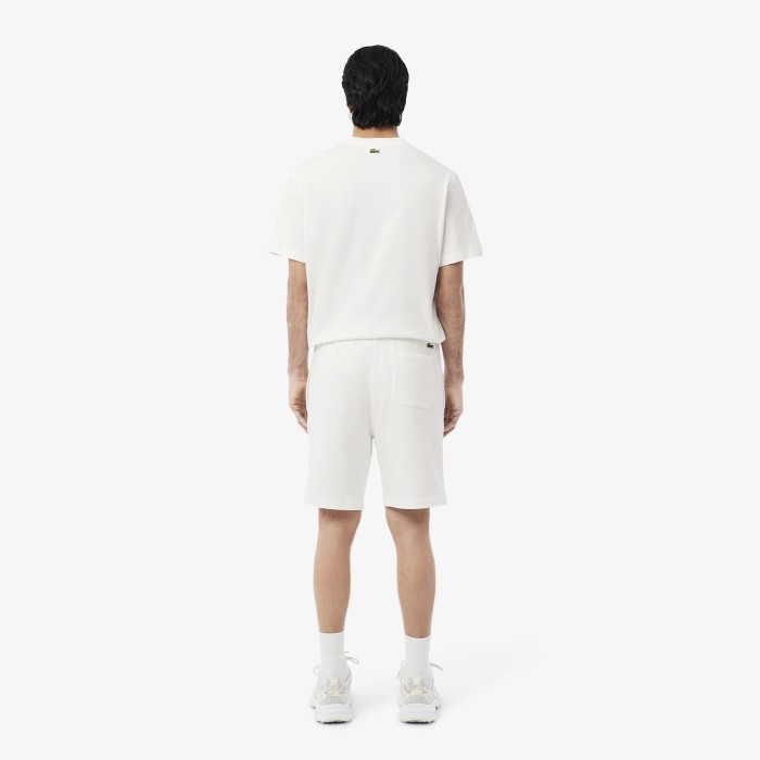 мужские шорты  из органического хлопка от бренда lacoste вид слева