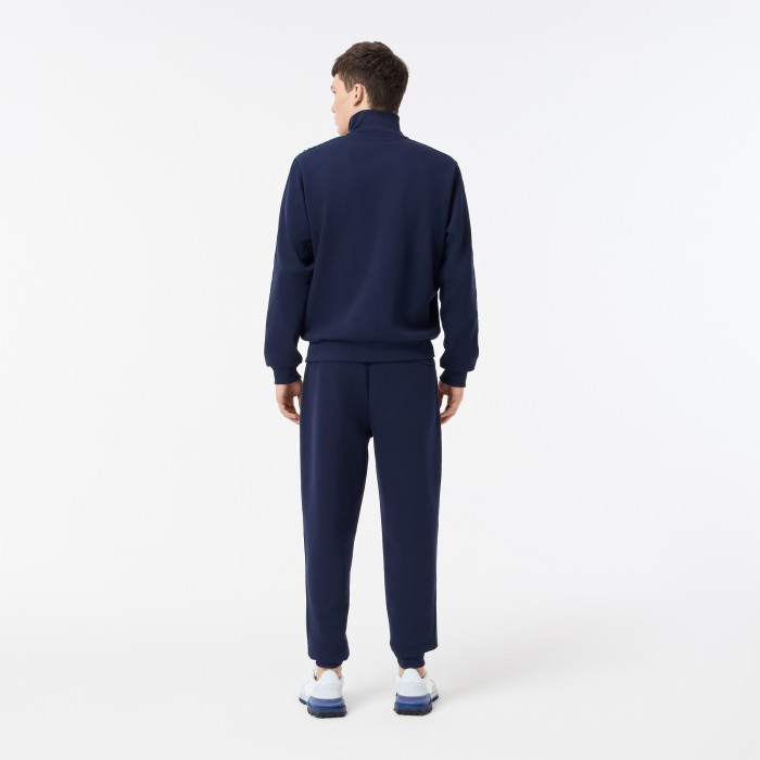 мужские спортивные брюки  из эластичного хлопка от бренда lacoste вид слева