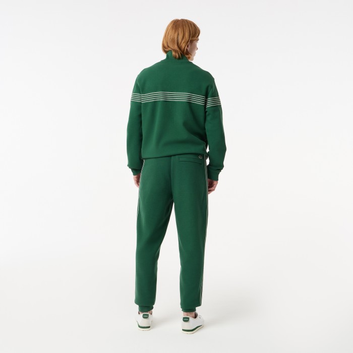 мужские спортивные брюки  из эластичного хлопка от бренда lacoste вид слева