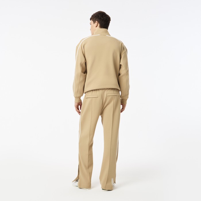 мужские спортивные брюки  из эластичного хлопка от бренда lacoste вид слева
