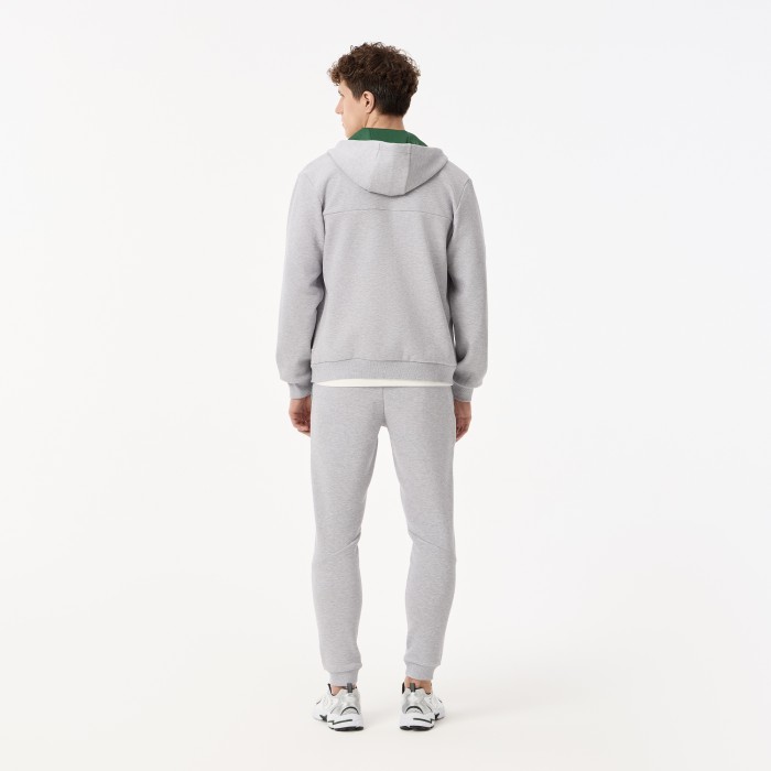 мужские спортивные брюки  из эластичного хлопка от бренда lacoste вид слева
