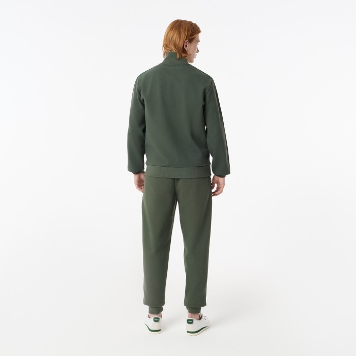 мужские спортивные брюки  из эластичного хлопка от бренда lacoste вид слева