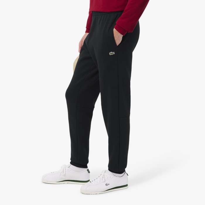мужские спортивные брюки из флиса зауженного кроя  от бренда lacoste вид слева