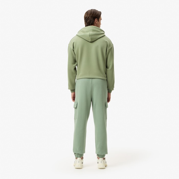 мужские спортивные брюки  из органического хлопка от бренда lacoste вид слева