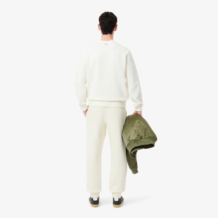 мужские спортивные брюки  из смеси органического хлопка от бренда lacoste вид слева