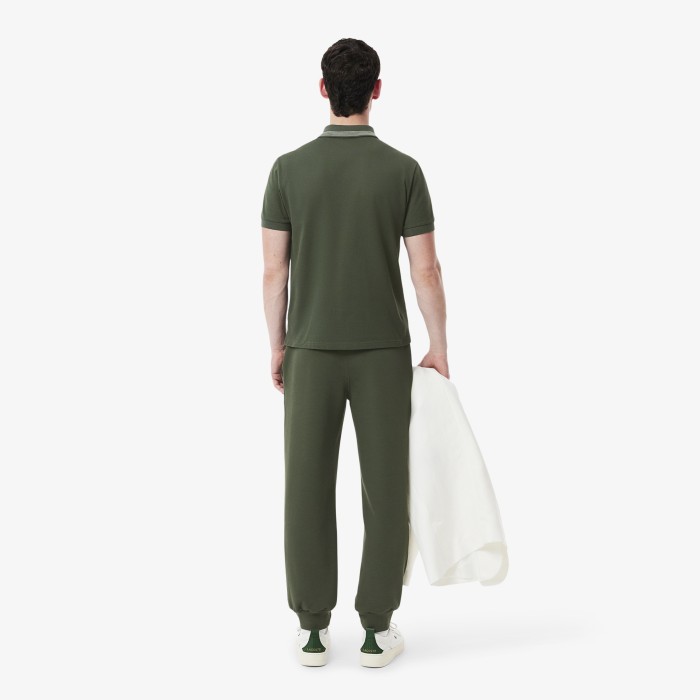 мужские спортивные брюки  из смеси органического хлопка от бренда lacoste вид слева