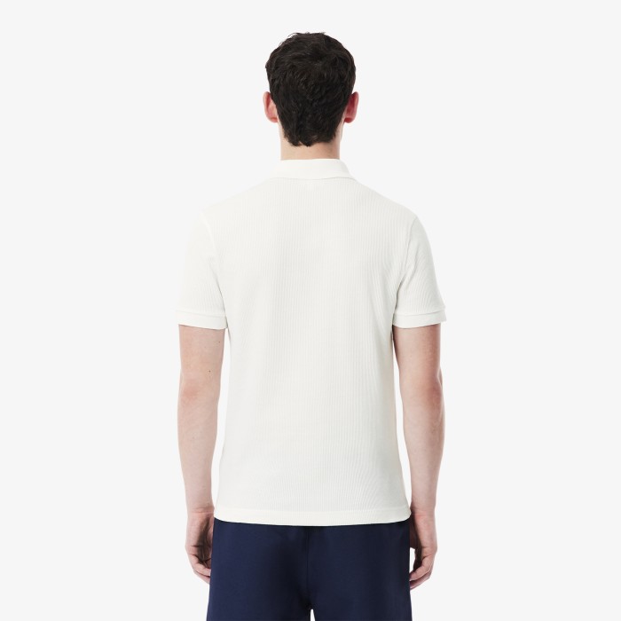 мужское поло  из хлопка от бренда lacoste вид слева