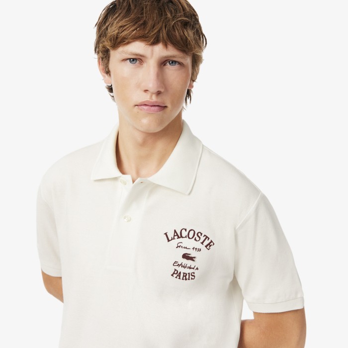 мужское поло  от бренда lacoste вид слева
