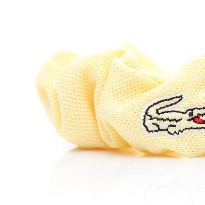 резинка для волос  от бренда lacoste вид слева