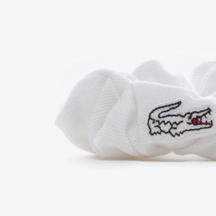резинка для волос  от бренда lacoste вид слева