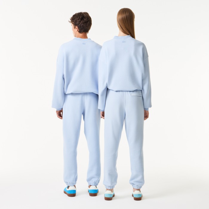 спортивные брюки  унисекс от бренда lacoste вид слева