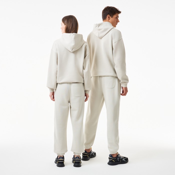 спортивные брюки  унисекс от бренда lacoste вид слева