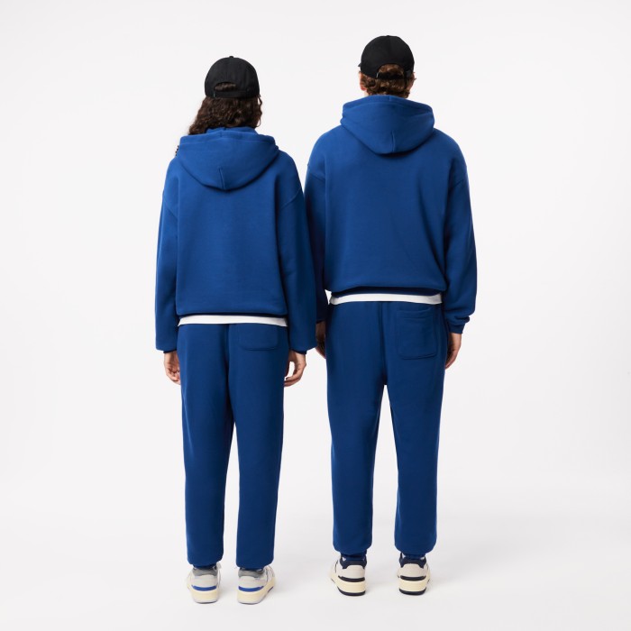 спортивные брюки  унисекс от бренда lacoste вид слева