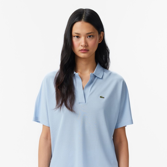 женская рубашка-поло  из струящегося хлопка свободного кроя от бренда lacoste вид слева
