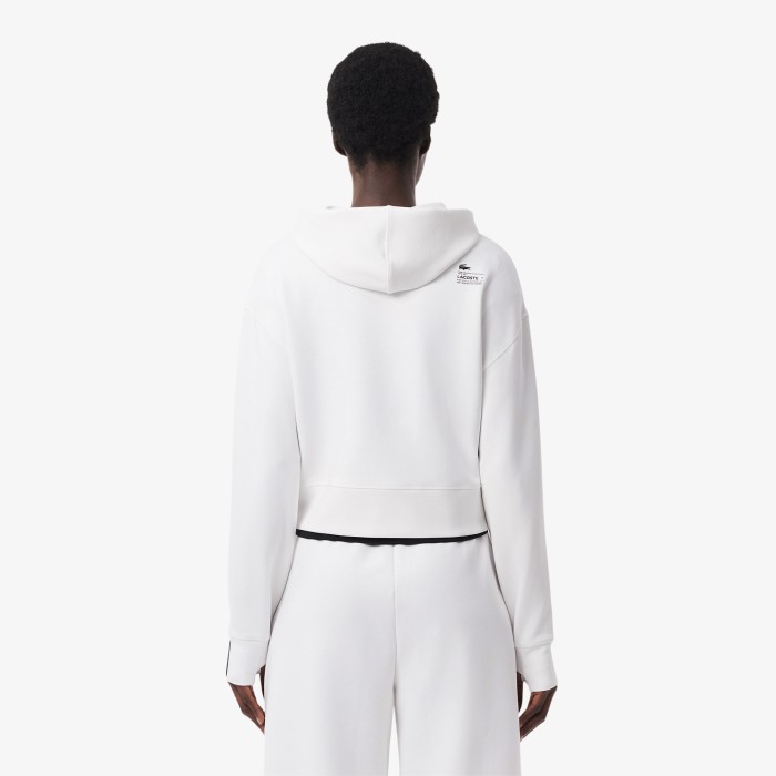женская толстовка  свободного кроя с капюшоном от бренда lacoste вид слева