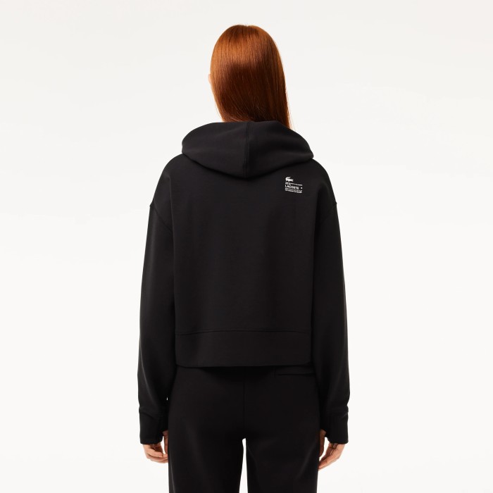 женская толстовка  свободного кроя с капюшоном от бренда lacoste вид слева