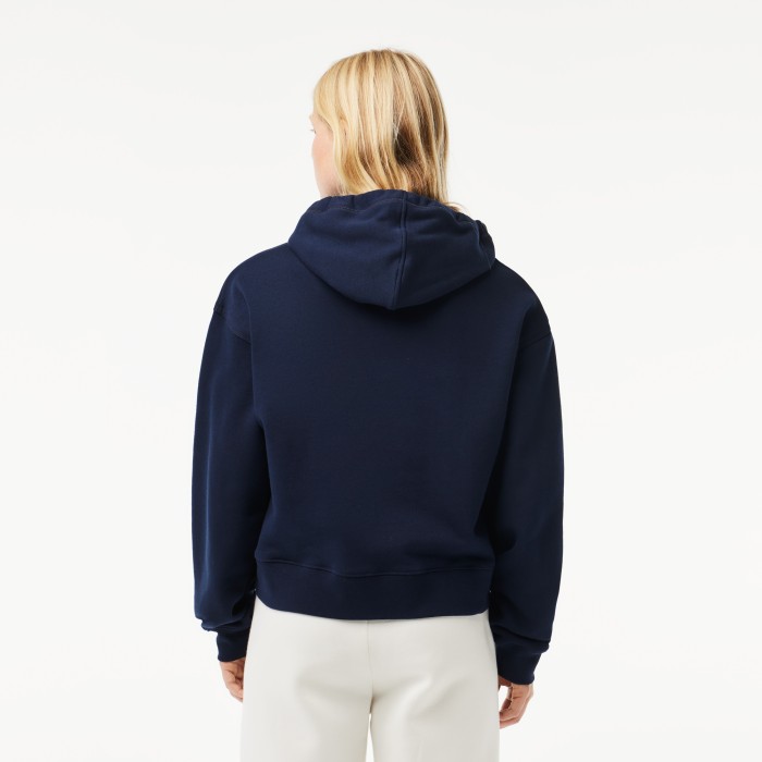 женская толстовка  свободного кроя с капюшоном от бренда lacoste вид слева