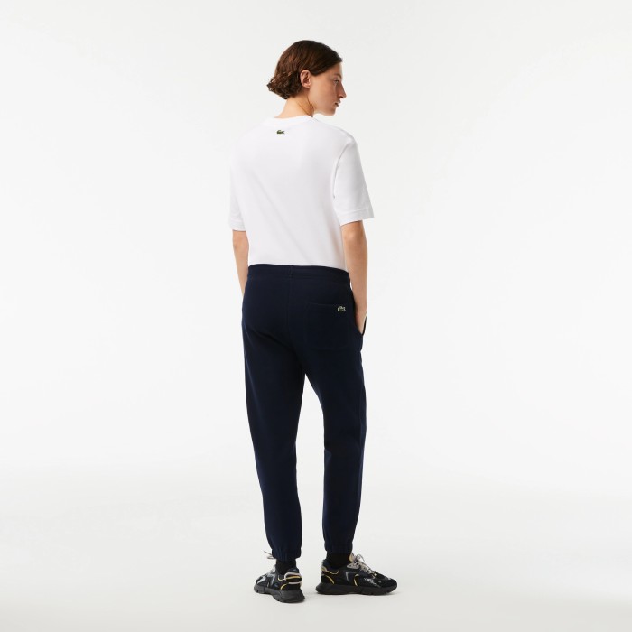 женские брюки  для спорта от бренда lacoste вид слева