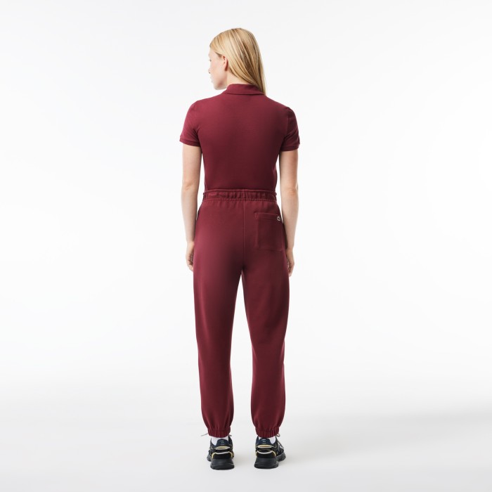 женские брюки  для спорта от бренда lacoste вид слева
