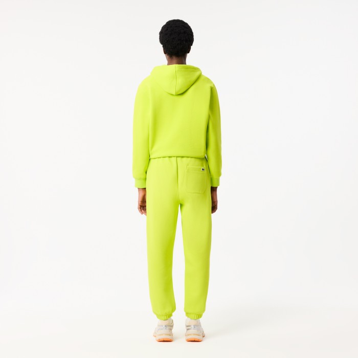 женские брюки  для спорта от бренда lacoste вид слева