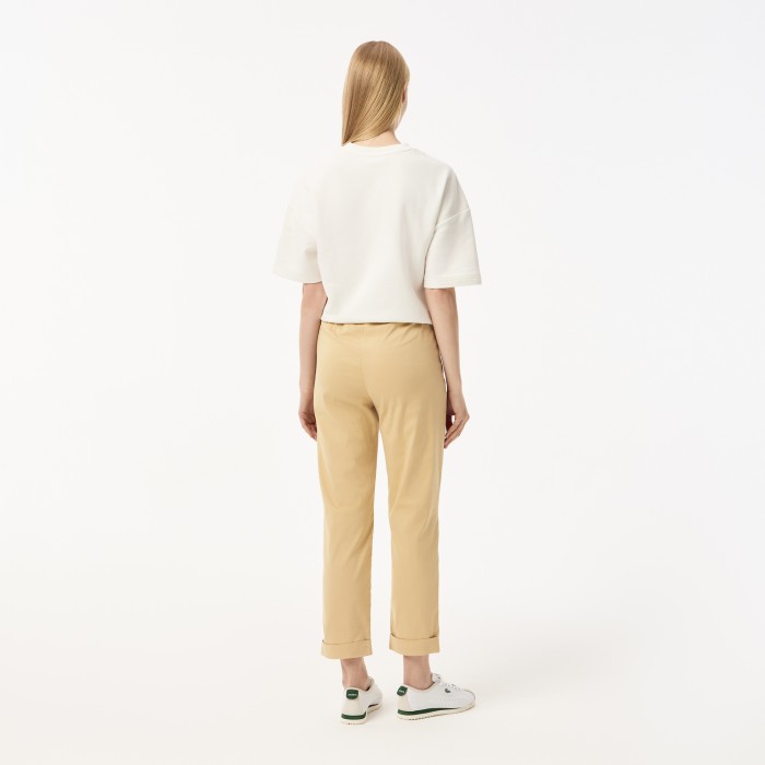 женские брюки  стандартного кроя с регулируемым поясом от бренда lacoste вид слева