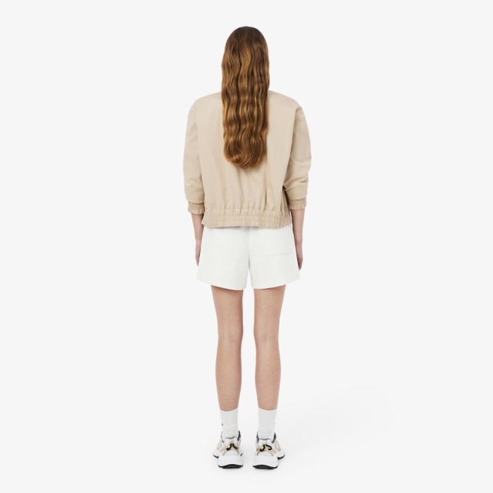 женские хлопковые шорты  из пике от бренда lacoste вид слева