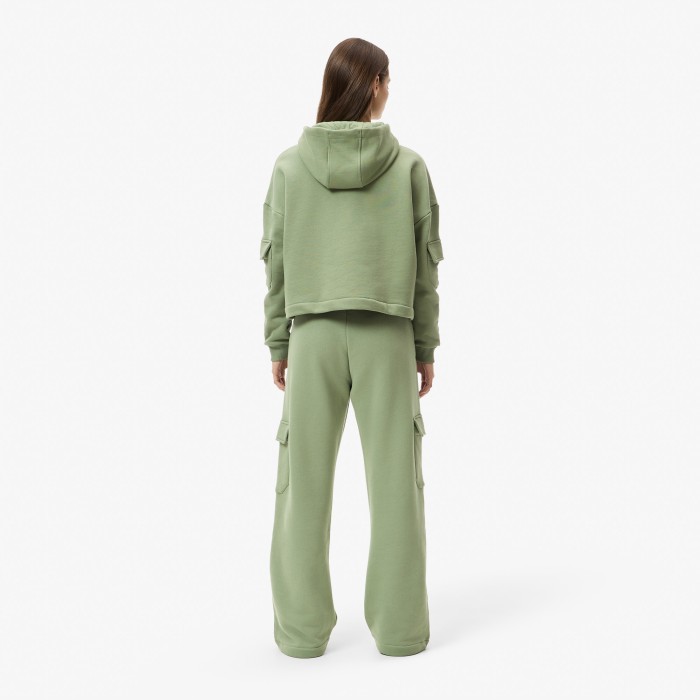 женские хлопковые спортивные брюки  свободного кроя от бренда lacoste вид слева