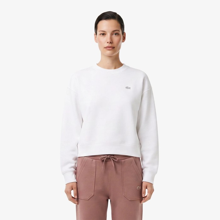 женские хлопковые спортивные брюки  от бренда lacoste вид слева