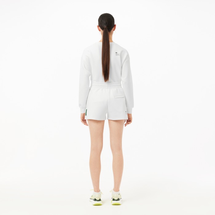 женские однотонные шорты  от бренда lacoste вид слева