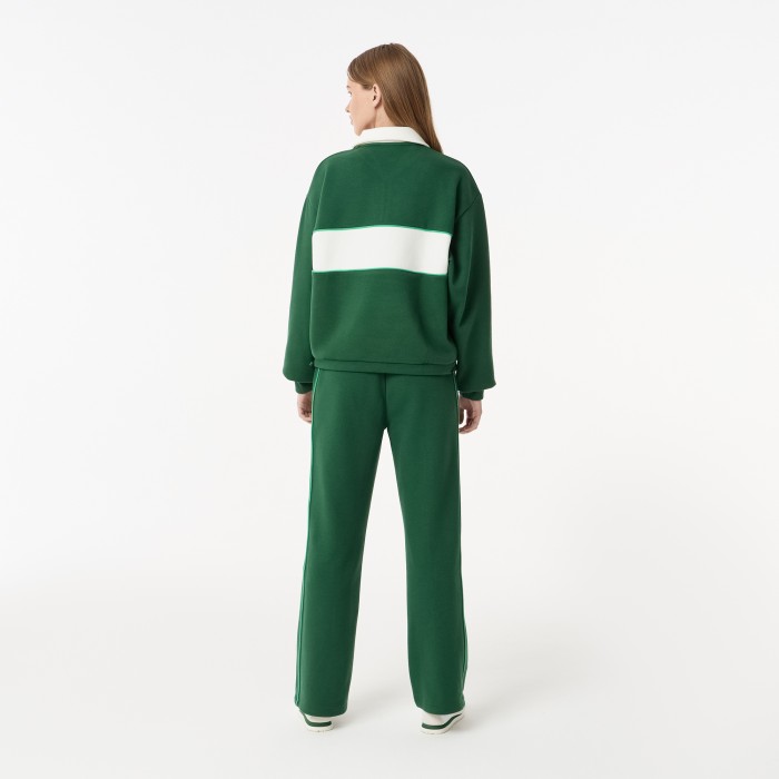 женские спортивные брюки  из эластичного хлопка от бренда lacoste вид слева